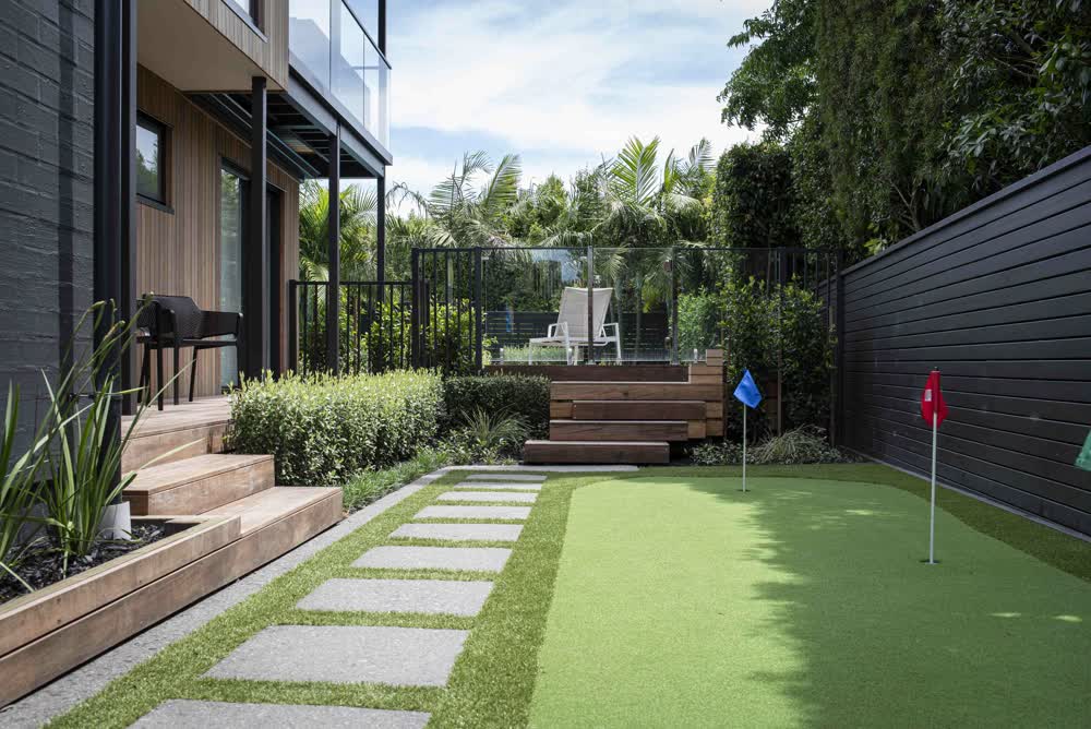 Lawn with pavers and putting green